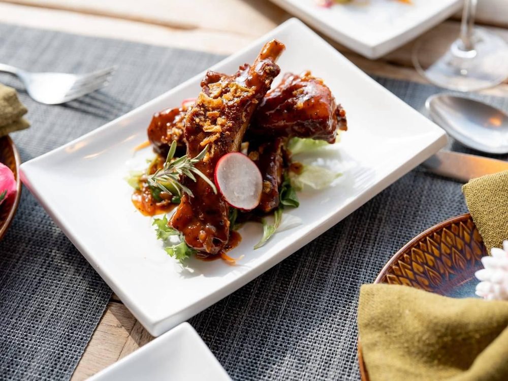 Spare ribs glazed and served on a white plate